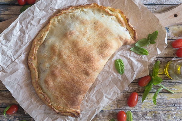 baked calzone on brown paper
