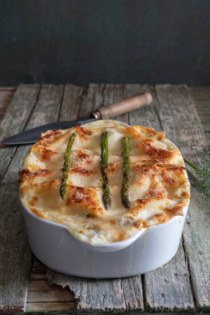 Asparagus lasagna in a white dish.