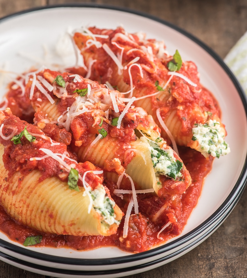 Stuffed shells on a white plate.