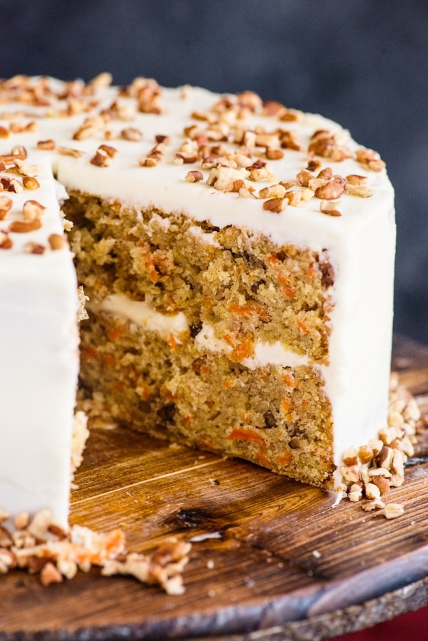 carrot cake on a wooden plate