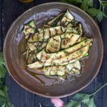 Grilled zucchini on a brown dish.