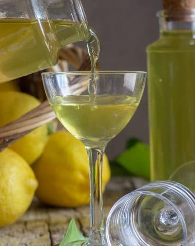 pouring limoncello in a glass