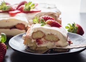 Strawberry Tiramisu,the perfect summer dessert, made with fresh strawberries, creamy mascarpone, and ladyfingers. fresh strawberries and cream.