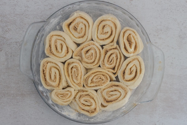 cinnamon rolls in the pan ready for baking