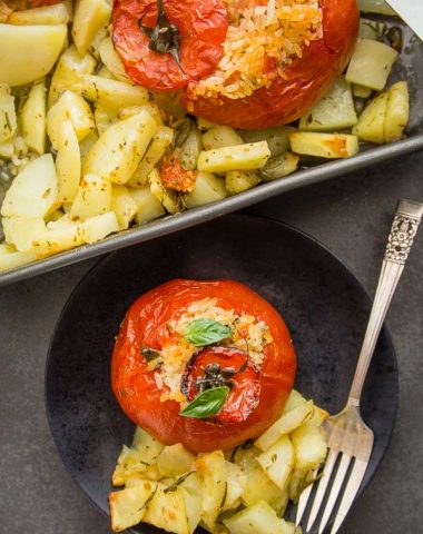 Baked Tomatoes Stuffed with Rice, a delicious Italian Recipe, whole tomatoes stuffed with a perfectly spiced rice and roasted potatoes.