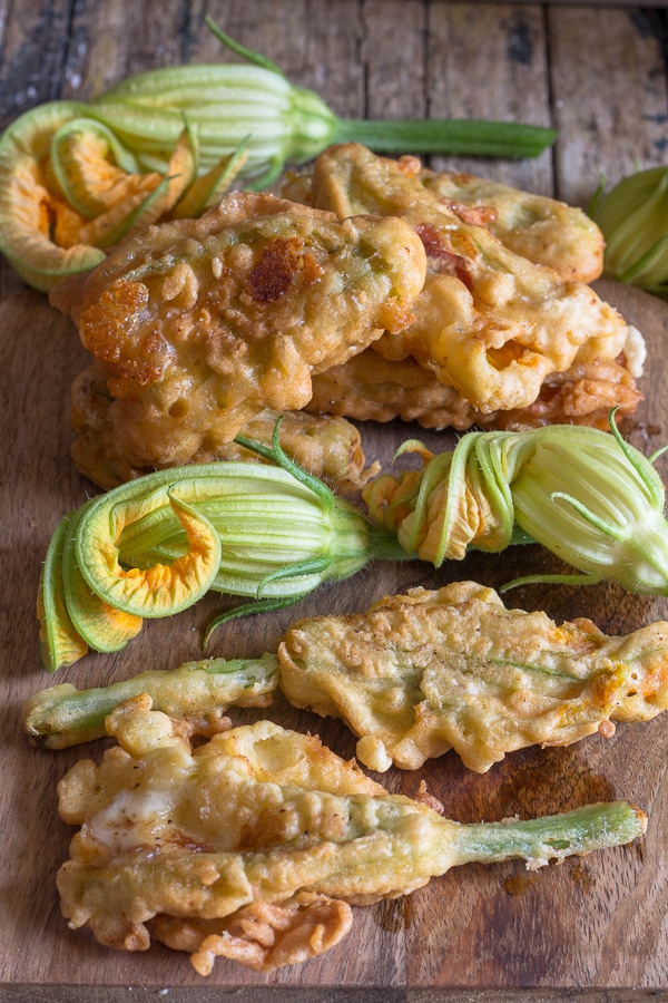 zucchini flowers on a wooden board