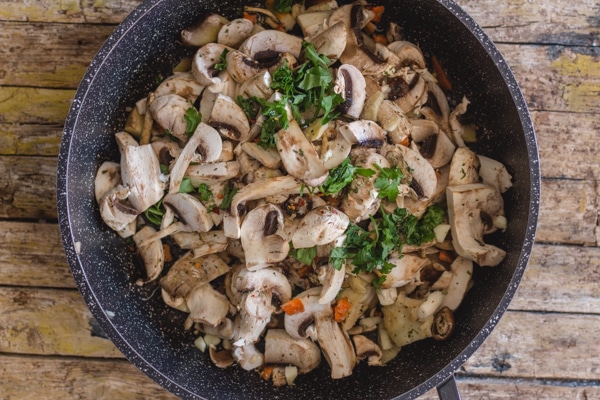 mixed mushrooms for mushroom fettuccine in a pan