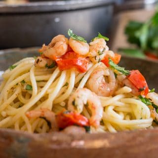 shrimp and tomato pasta in a dish