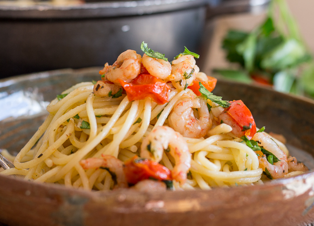 shrimp and tomato pasta in a dish