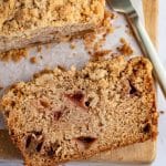 Apple loaf with a slice cut.