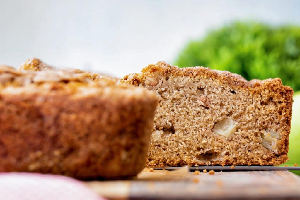 Apple loaf with a slice cut.