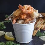 fried seafood in a white bucket