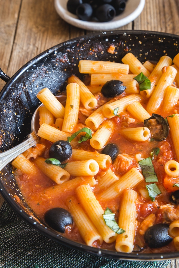 tuna and olive pasta in a black pan