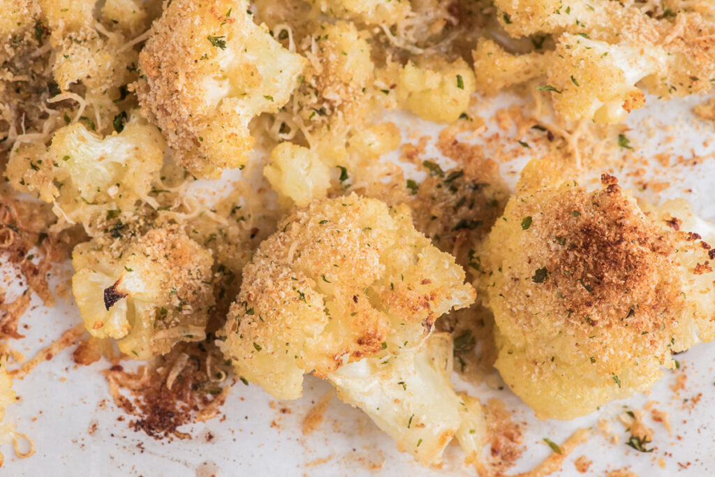 Parmesan roasted cauliflower on a baking sheet.