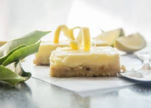 lemon cheesecake squares on a board