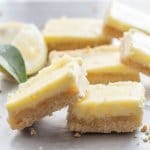 Lemon Cheesecake Squares, a delicious almond shortbread base & a creamy lemony filling. The perfect Cookie Bar or Dessert recipe.