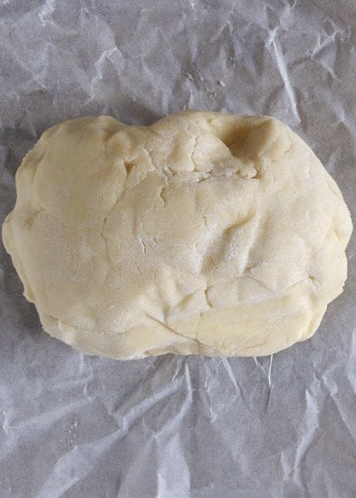 The compact dough on parchment paper.