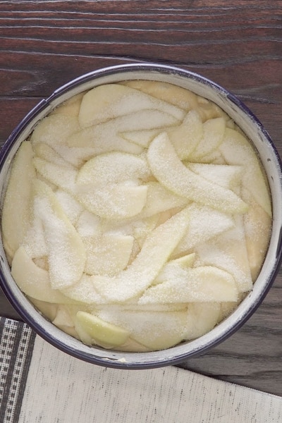 Pear on batter in the cake pan.