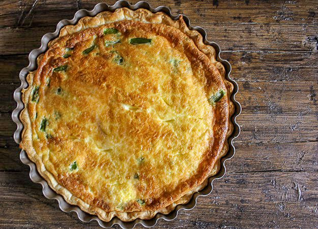finished asparagus quiche in a pie pan