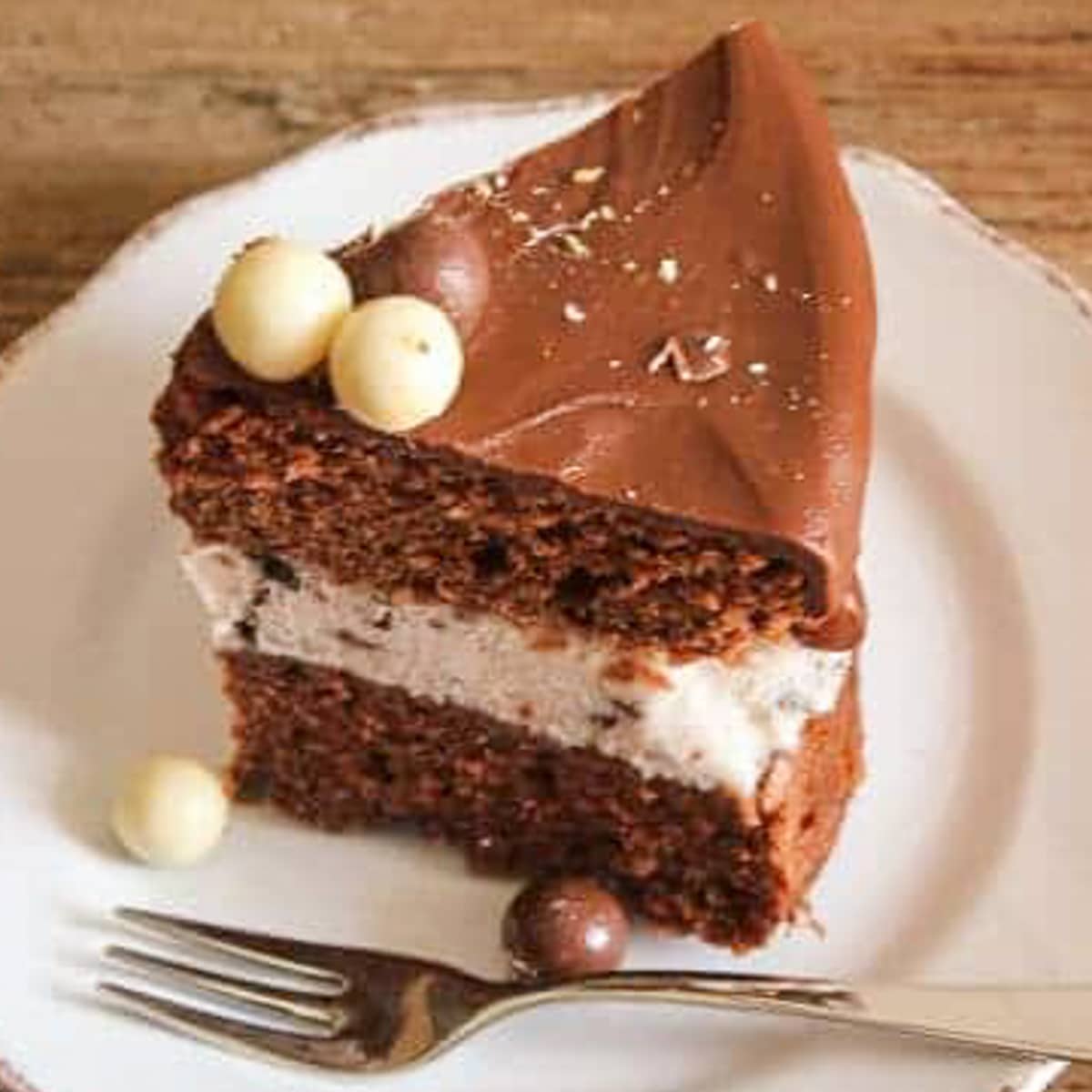 A slice of cake on a white plate.