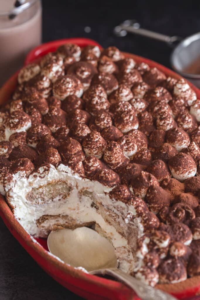 Tiramisu for kids in a red dish.