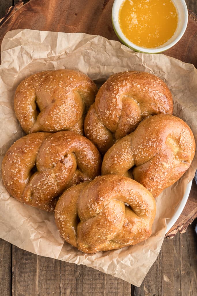 Pretzels in a bowl lined with brown paper.