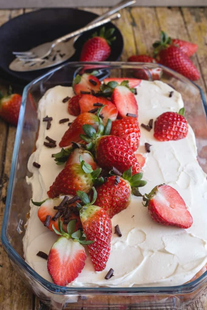 Strawberry dessert in a glass pan.