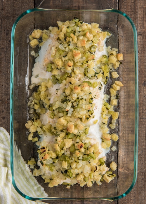 The baked stuffed halibut in a glass dish.