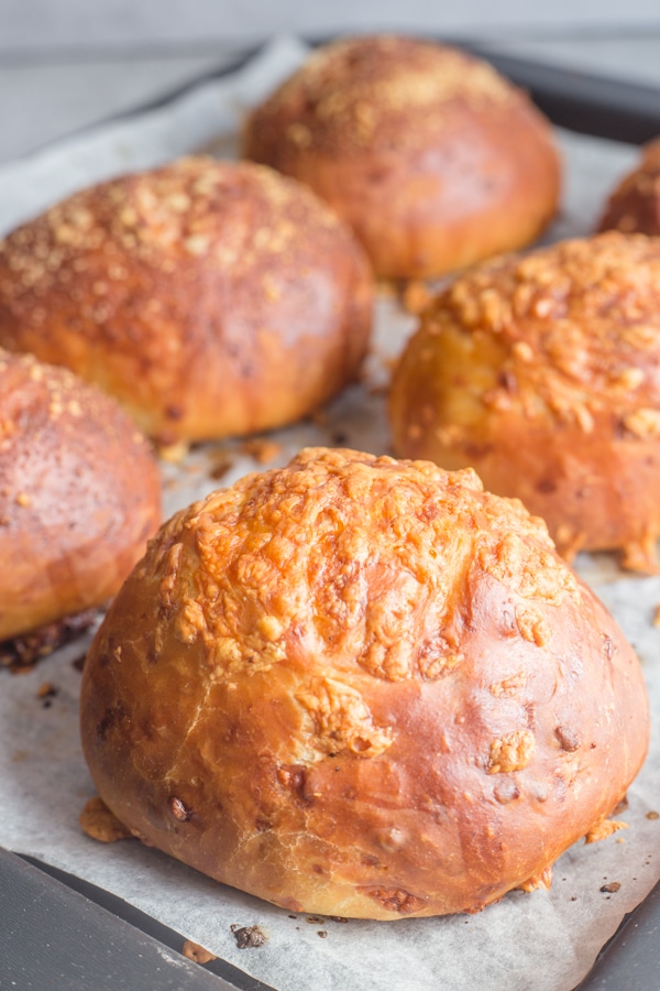 cheese buns baked on a cookie sheet