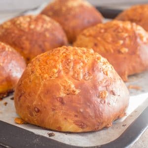 cheese buns baked on a cookie sheet