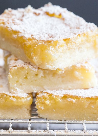 lemon squares four slices on a wire rack