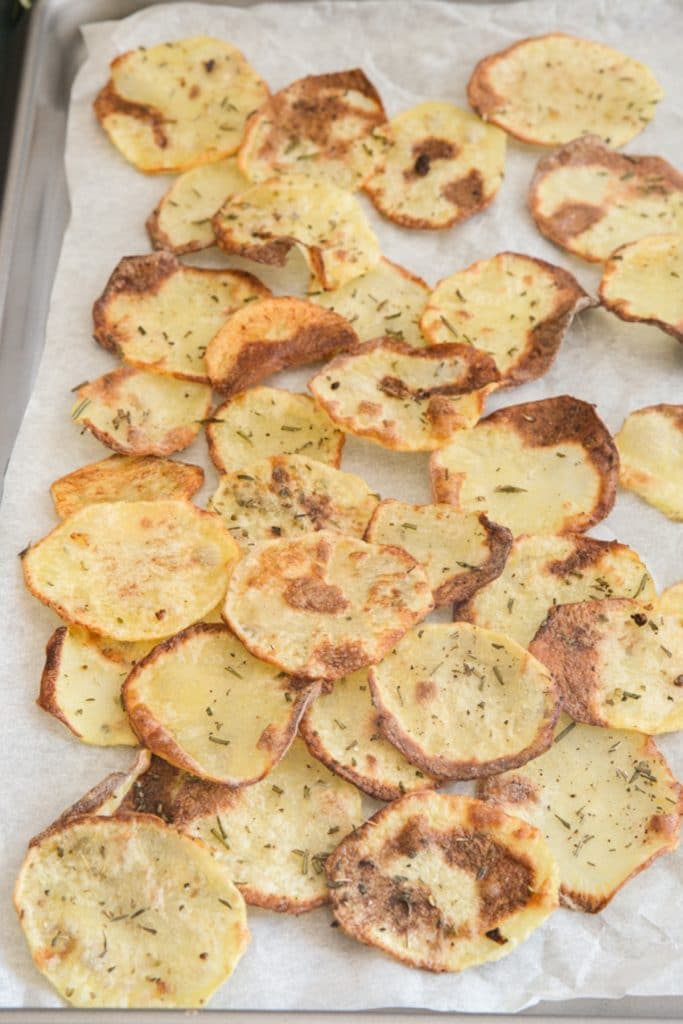Potato chips on a cookie sheet.