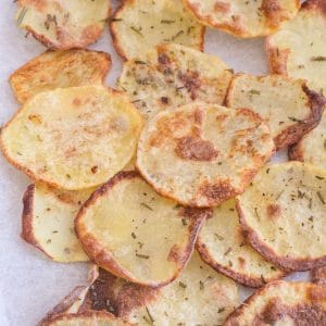 Potato chips on a cookie sheet.