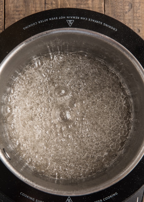 Boiling the sugar water ingredients.