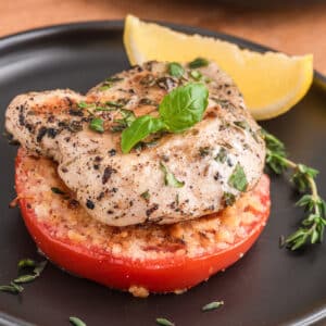 Grilled chicken on a breaded tomato.