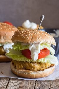salmon burger with lettuce, tomato and sauce