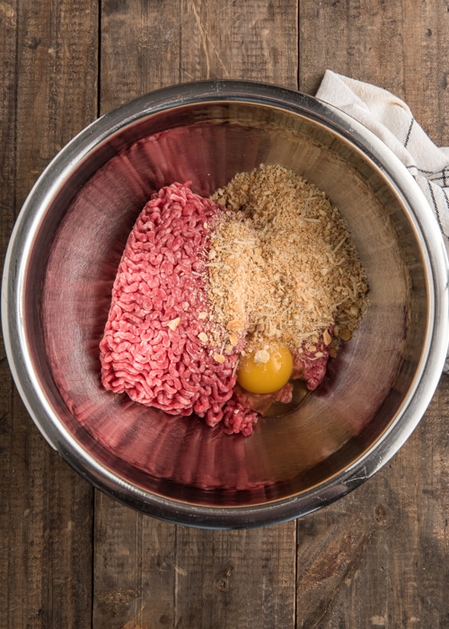 The hamburger mixture in a silver bowl before combining.