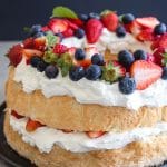 angel food cake with whipped cream and berries two layer cake
