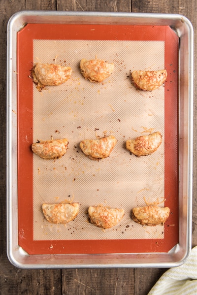 The baking appetizers on a baking sheet.