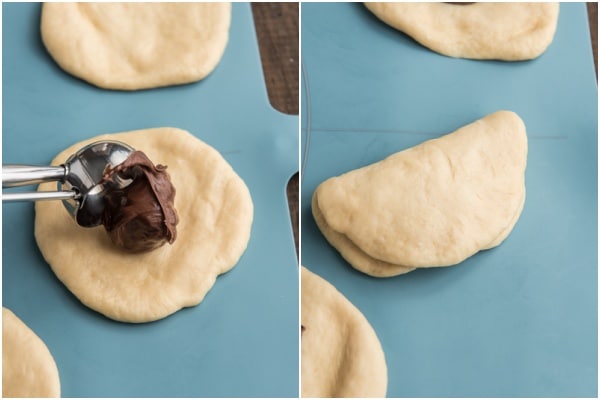 Spreading Nutella on the dough and folding in half.