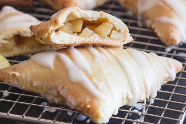 a cut in half apple turnover on top of another one