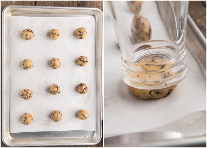 Dough balls on a cookie sheet and flattening with a glass.