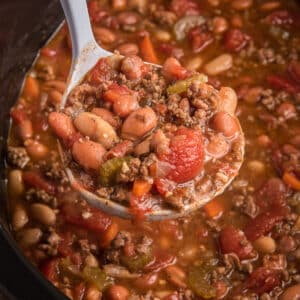 Chili in a pot and on a spoon.