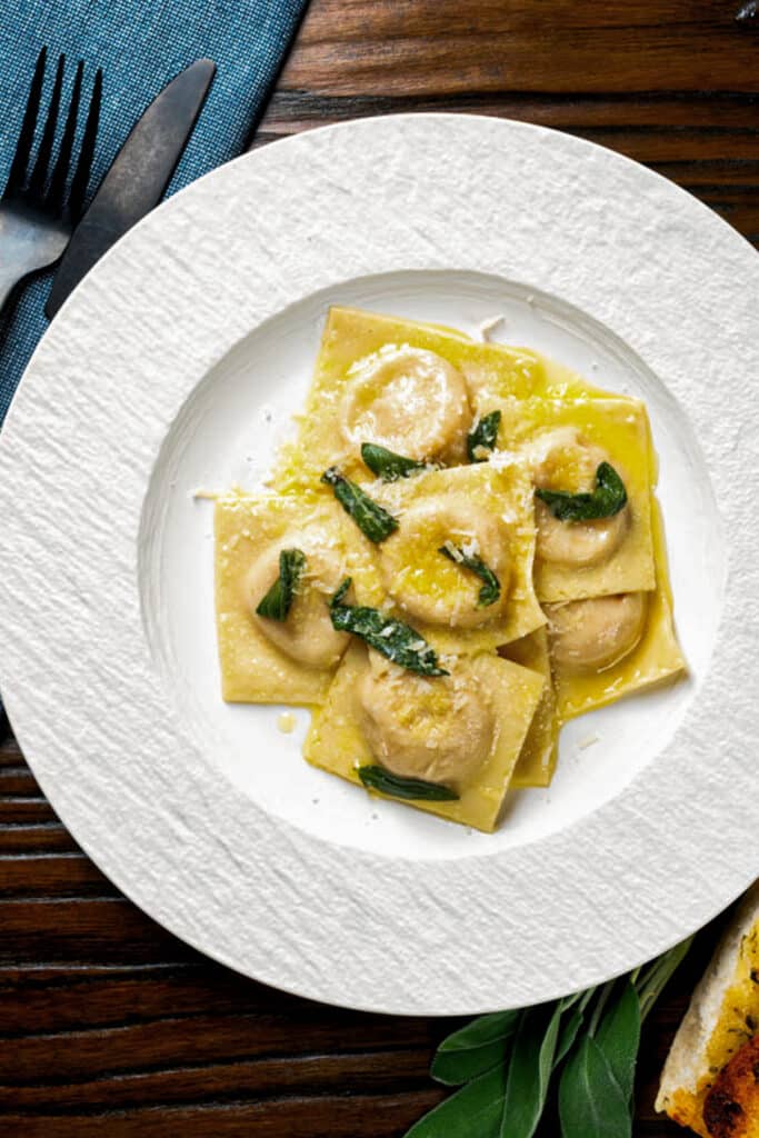 Ravioli on a white plate.