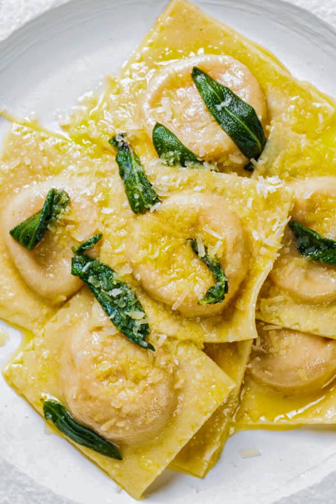 The ravioli on a white plate.