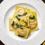 The ravioli on a white plate.