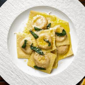 The ravioli on a white plate.