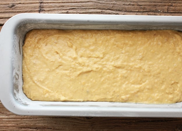 banana bread batter is in the loaf pan