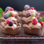 chocolate mousse tarts on a wire rack