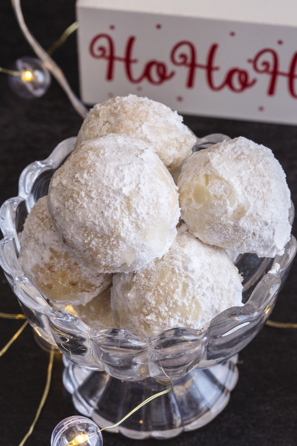 snowball cookies in a glass bowl